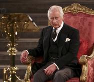 Britain's King Charles III sits at Westminster Hall, where both Houses of Parliament are meeting to express their condolences following the death of Queen Elizabeth II, at Westminster Hall, in London, Monday, Sept. 12, 2022. Queen Elizabeth II, Britain's longest-reigning monarch, died Thursday after 70 years on the throne. (Henry Nicholls/Pool Photo via AP)