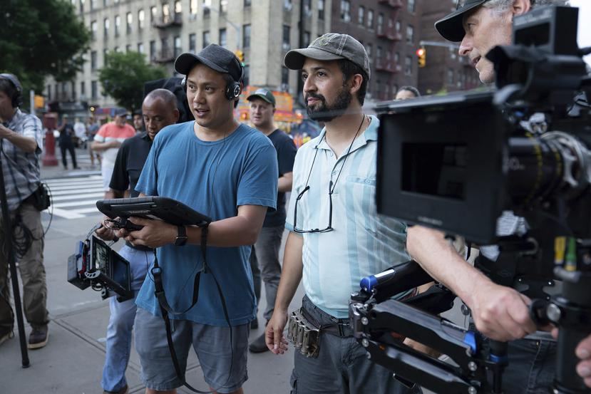 This image released by Warner Bros. Picures shows director Jon M. Chu, left, and Lin-Manuel Miranda on the set of "In the Heights," which will open the Tribeca Film Festival in June. (Macall Polay/Warner Bros. Entertainment via AP)