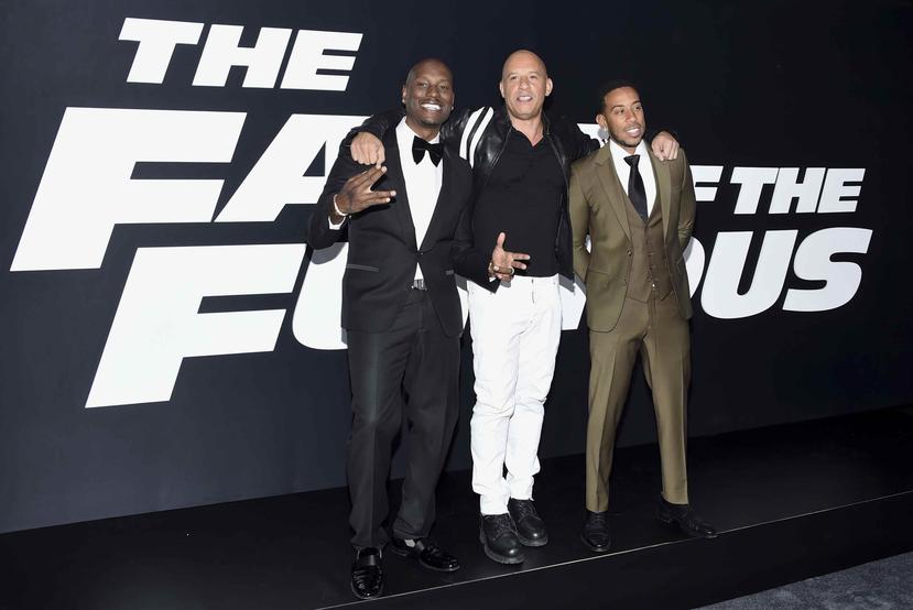 Tyrese Gibson, Vin Diesel y Ludacris, de izquierda a derecha, asisten al estreno mundial de "The Fate of the Furious" en Nueva York. (Evan Agostini / Invision / AP)