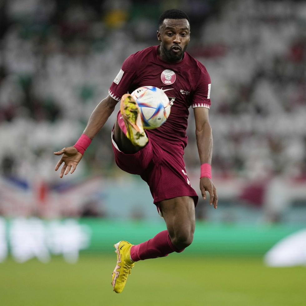 Qatar's Ismail Mohamad controls the ball during the World Cup group A soccer match between Qatar and Senegal, at the Al Thumama Stadium in Doha, Qatar, Friday, Nov. 25, 2022. (AP Photo/Thanassis Stavrakis)