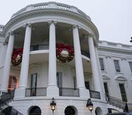 Wreaths hang on the Truman Balcony of the White House in Washington, Sunday, Nov. 27, 2022. (AP Photo/Susan Walsh)