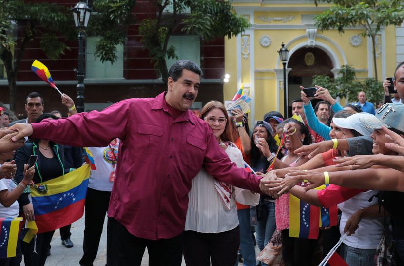 El presidente venezolano, Nicolás Maduro, y su esposa, Cilia Flores, durante un acto de gobierno. (EFE)