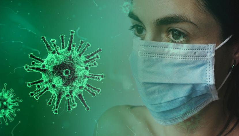 Foto concepto de virus SARS-CoV-2 y contagio en la que aparece mujer con mascarilla.