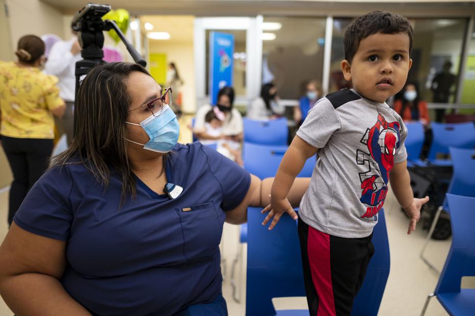 Elias Pagan Concepcion, one of the little ones who came to the place for vaccination, was two years old, with his mother, Nell Concepcion Silva.