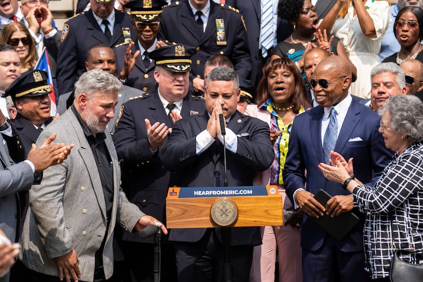 Edward A. Cabán gestures after being sworn in as NYPD police commissioner outside New York City Police Department.