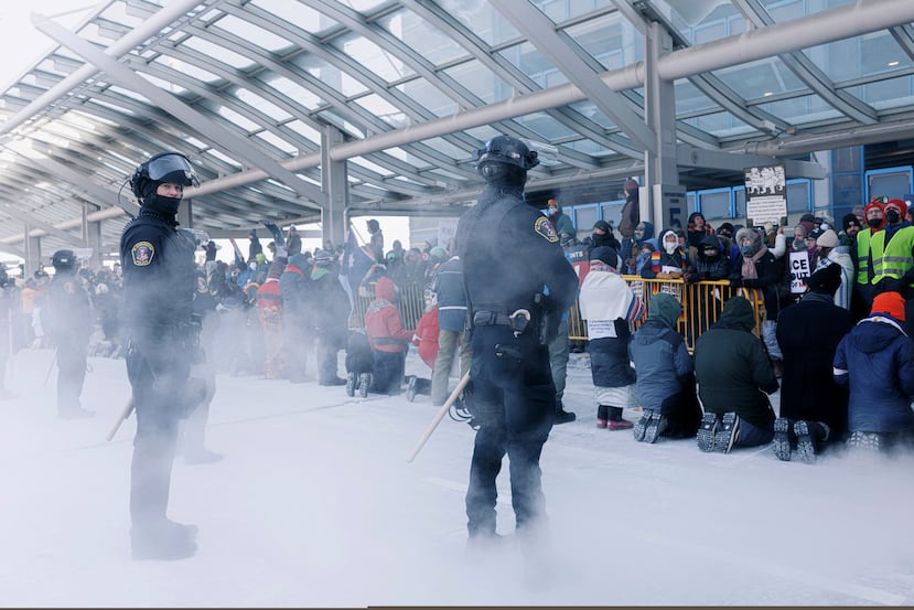 Clergy members and community activists gather at the Minneapolis-St. Paul International Airport, to protest deportation flights and urge airlines to call for an end to the Department of Homeland Security's operation, on Friday, Jan. 23, 2026, in St. Paul, Minn. (Kerem Yücel/Minnesota Public Radio via AP)