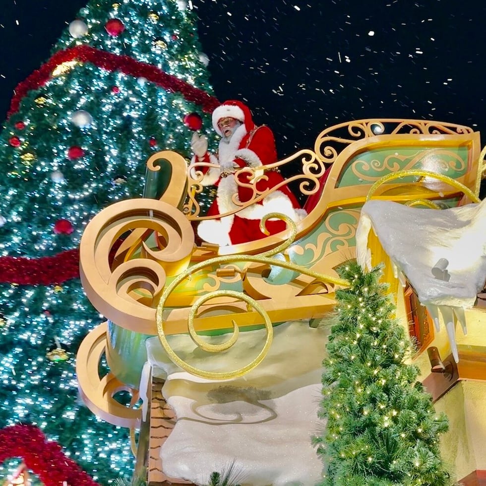 Santa Claus tops off the Universals Holiday Parade featuring Macys.