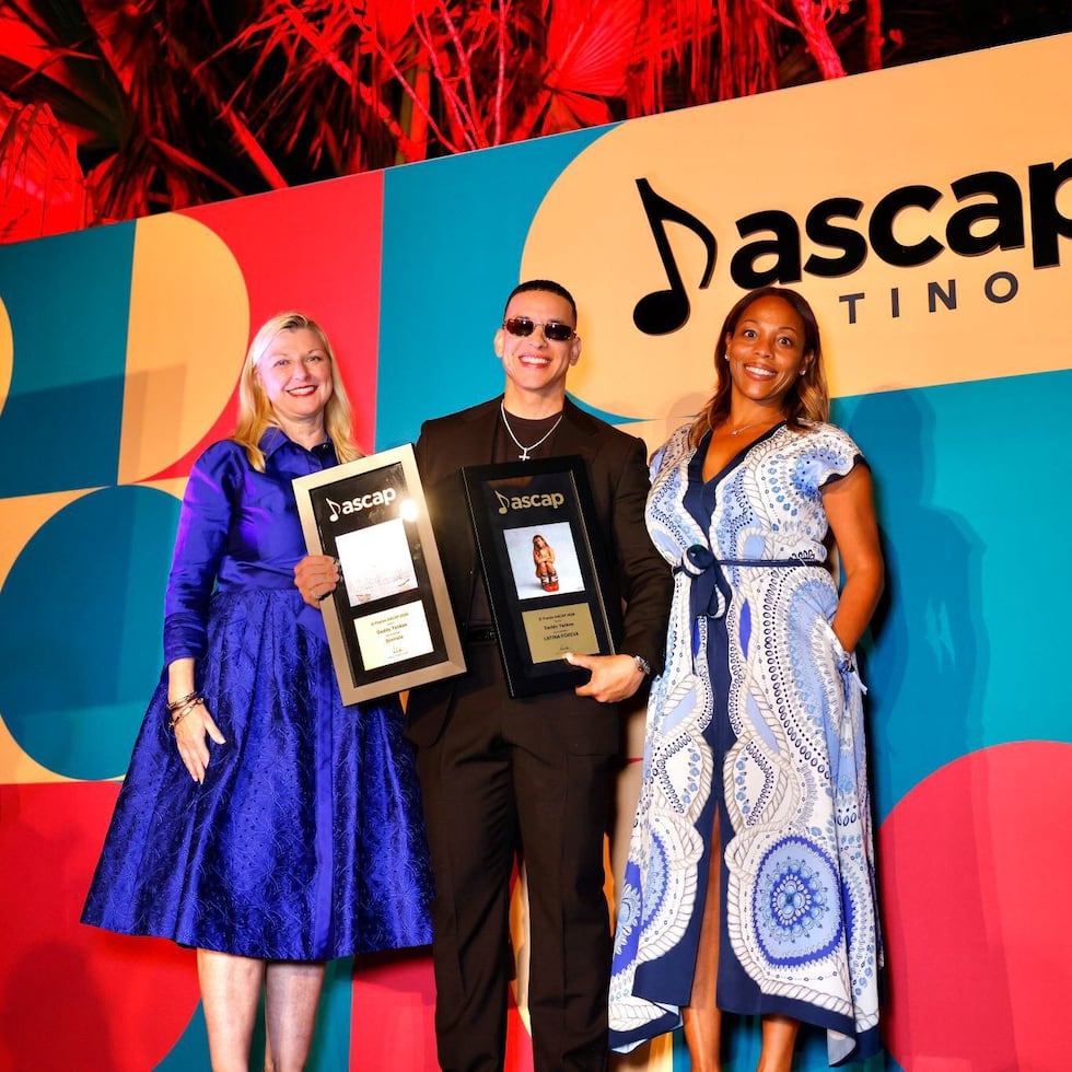 Daddy Yankee poses with his two awards.