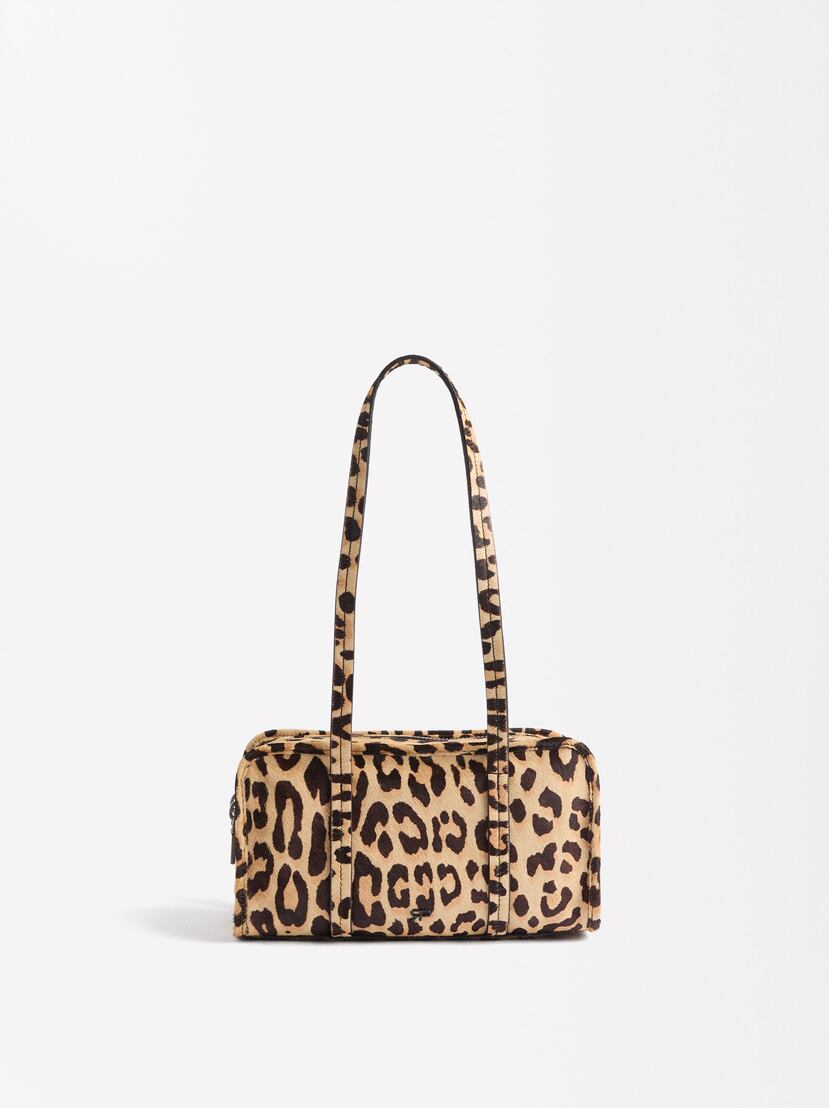 El animal “print” nunca pasa de moda. Cartera de Parfois.