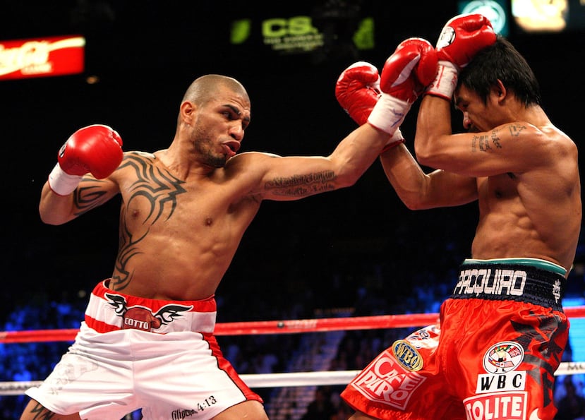 Miguel Cotto fue un pegador formidable que ganí 33 peleas por nocaut. Aquí frente a Manny Pacquiao. (Archivo)