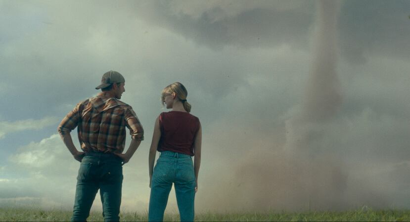 This image released by Universal Pictures shows Glen Powell, left, and Daisy Edgar-Jones in a scene from "Twisters." (Universal Pictures via AP)