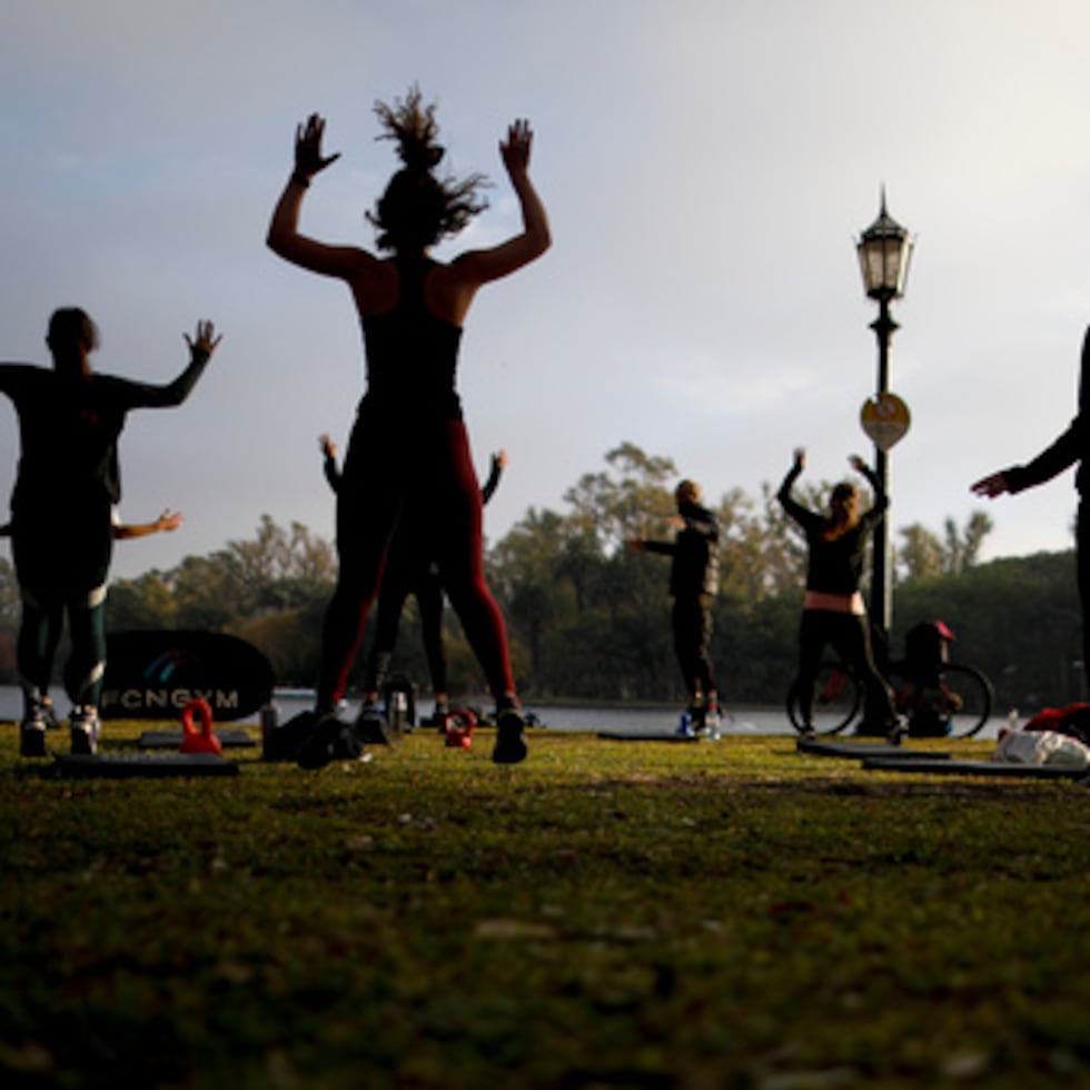 FILE - People exercise at a park in Buenos Aires, Argentina on June 2, 2021. (AP Photo/Natacha Pisarenko, File)
