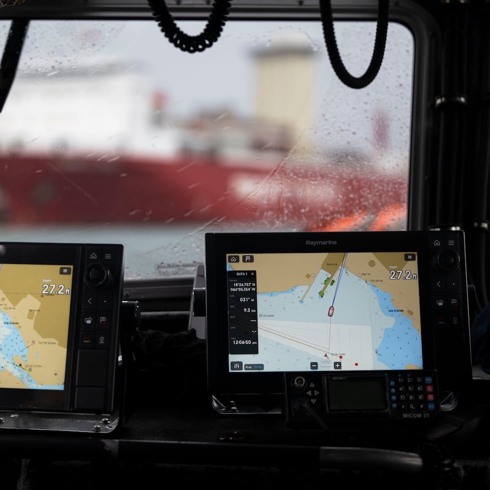 Commander Alejandro Collazo, head of the Coast Guard Prevention Department, San Juan sector, explains a safety situation related to vessel anchoring in the bay.