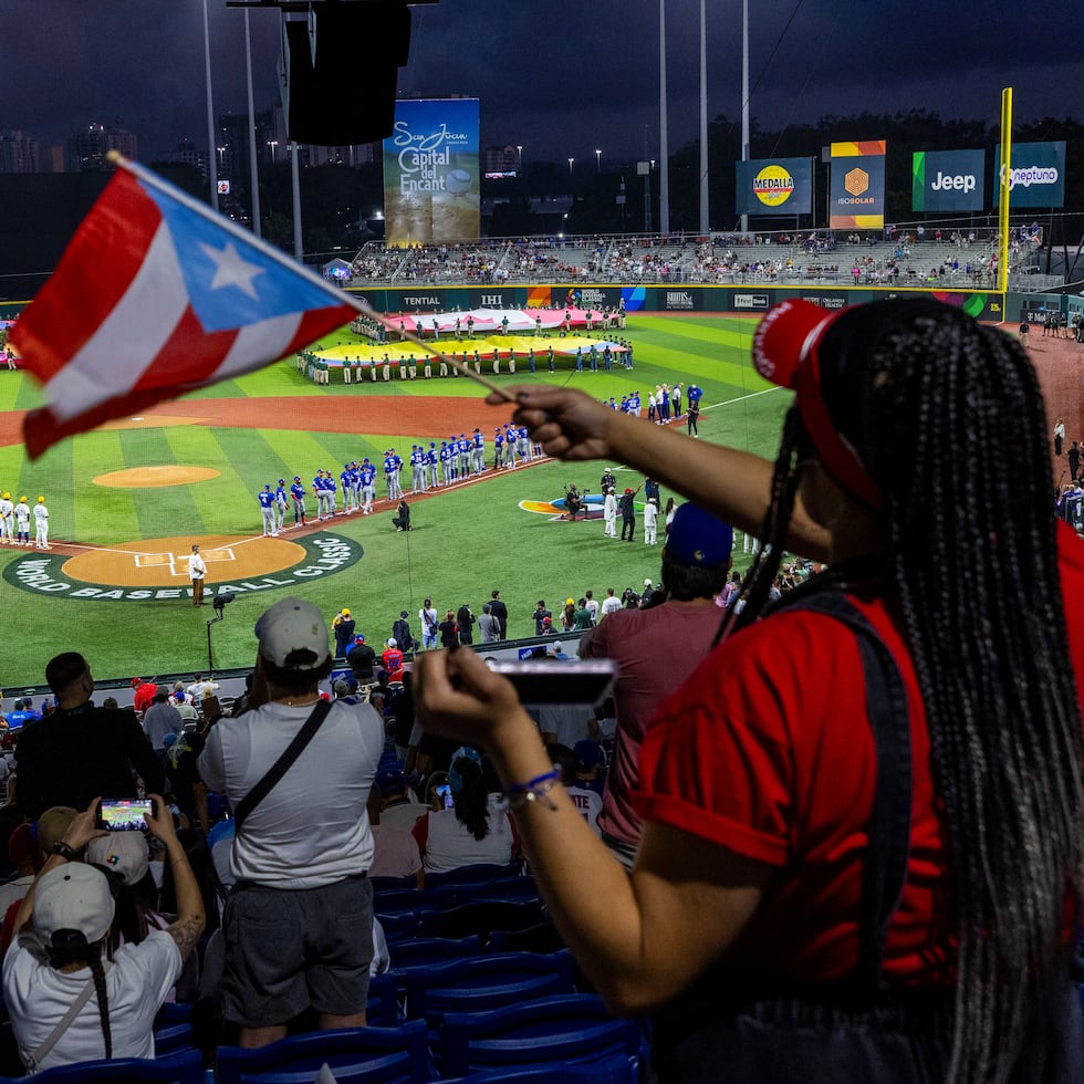 A fan waves the monostar during the group stage of the World Baseball Classic at Hiram Bithorn Stadium.