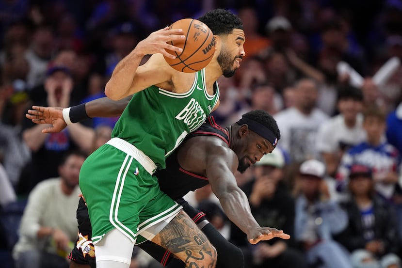 Boston Celtics' Jayson Tatum, left, tries to get past Philadelphia 76ers' Adem Bona during the second half of Game 3 in a first-round NBA playoffs basketball series Friday, April 24, 2026, in Philadelphia. (AP Photo/Matt Slocum)
