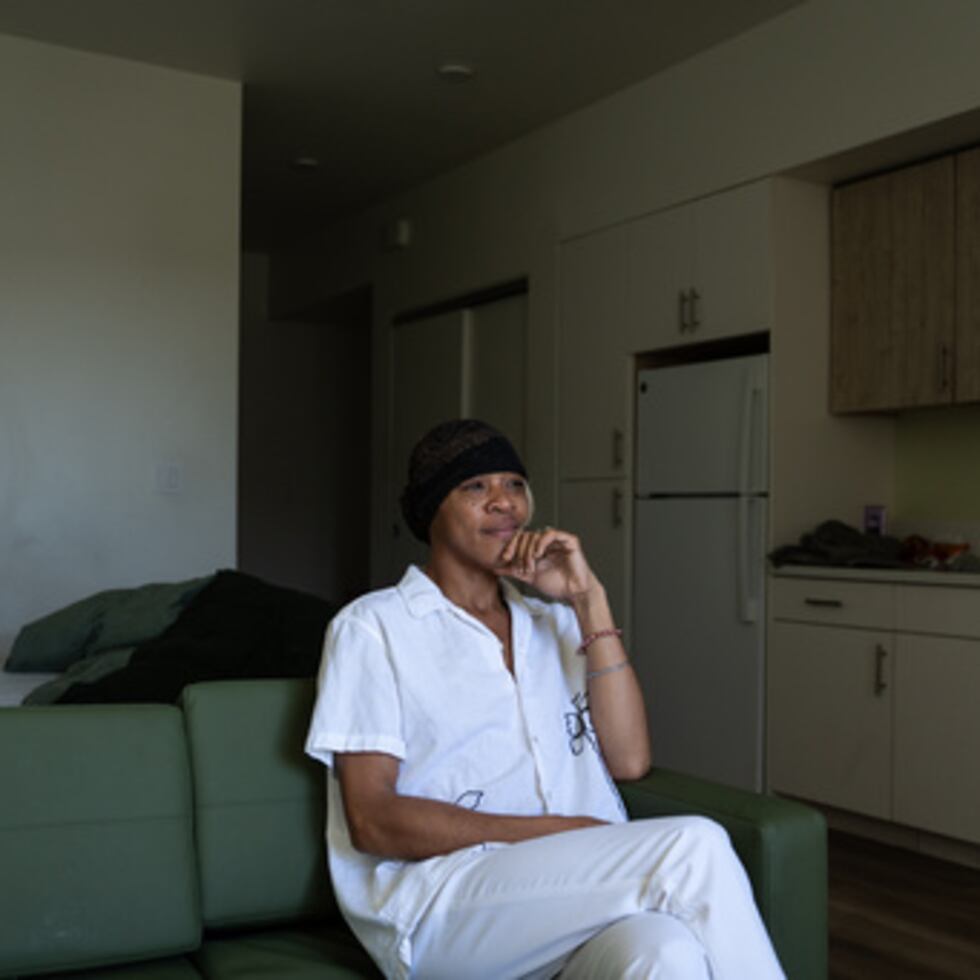 Quantavia Smith sits for a photo in her studio apartment at the Santa Monica and Vermont Apartments in Los Angeles, Monday, Nov. 10, 2025. (AP Photo/Jae C. Hong)