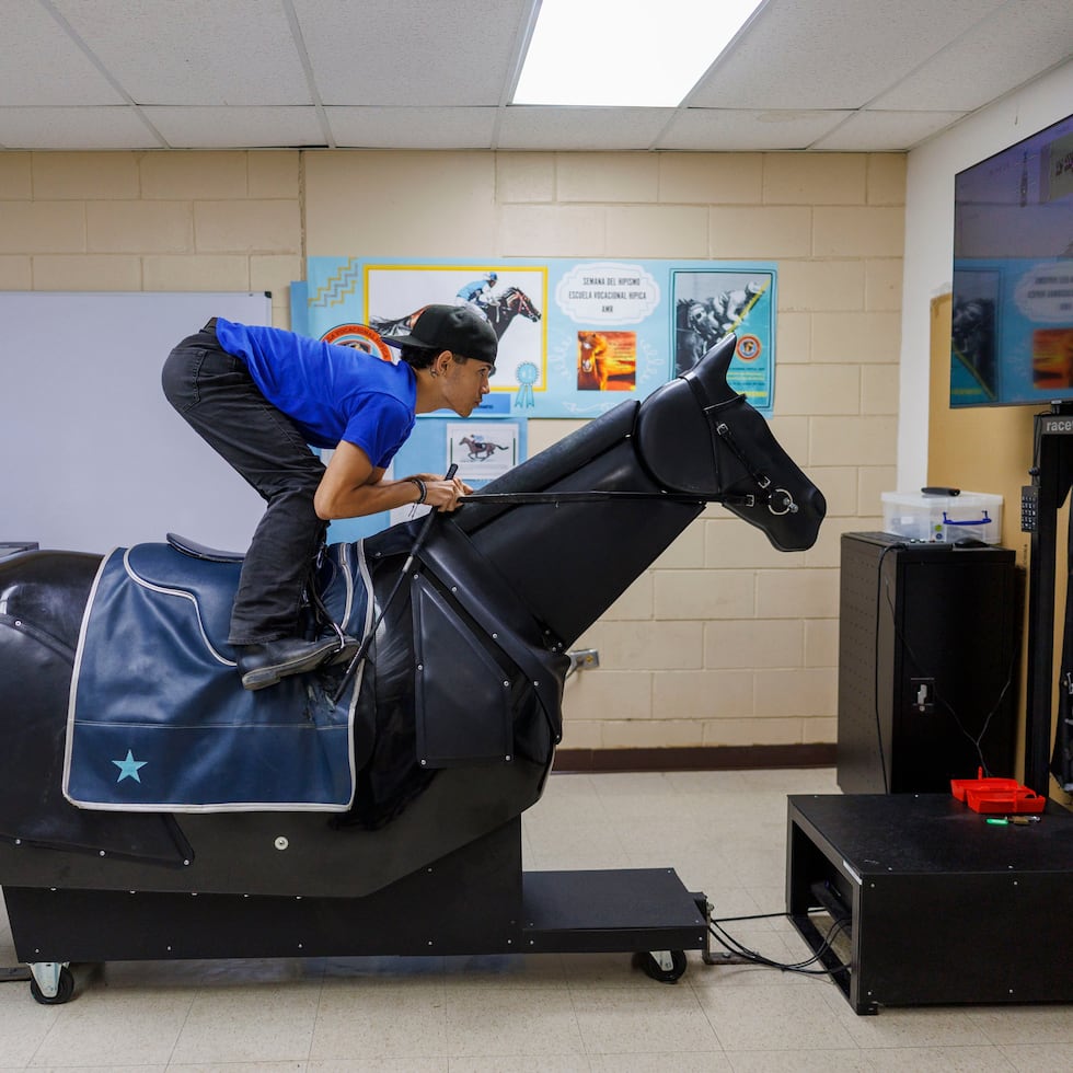Jockey candidates work on their posture on the horse in simulators designed to correct, strengthen and perfect their riding technique at the school located on the grounds of the Camarero Racecourse.