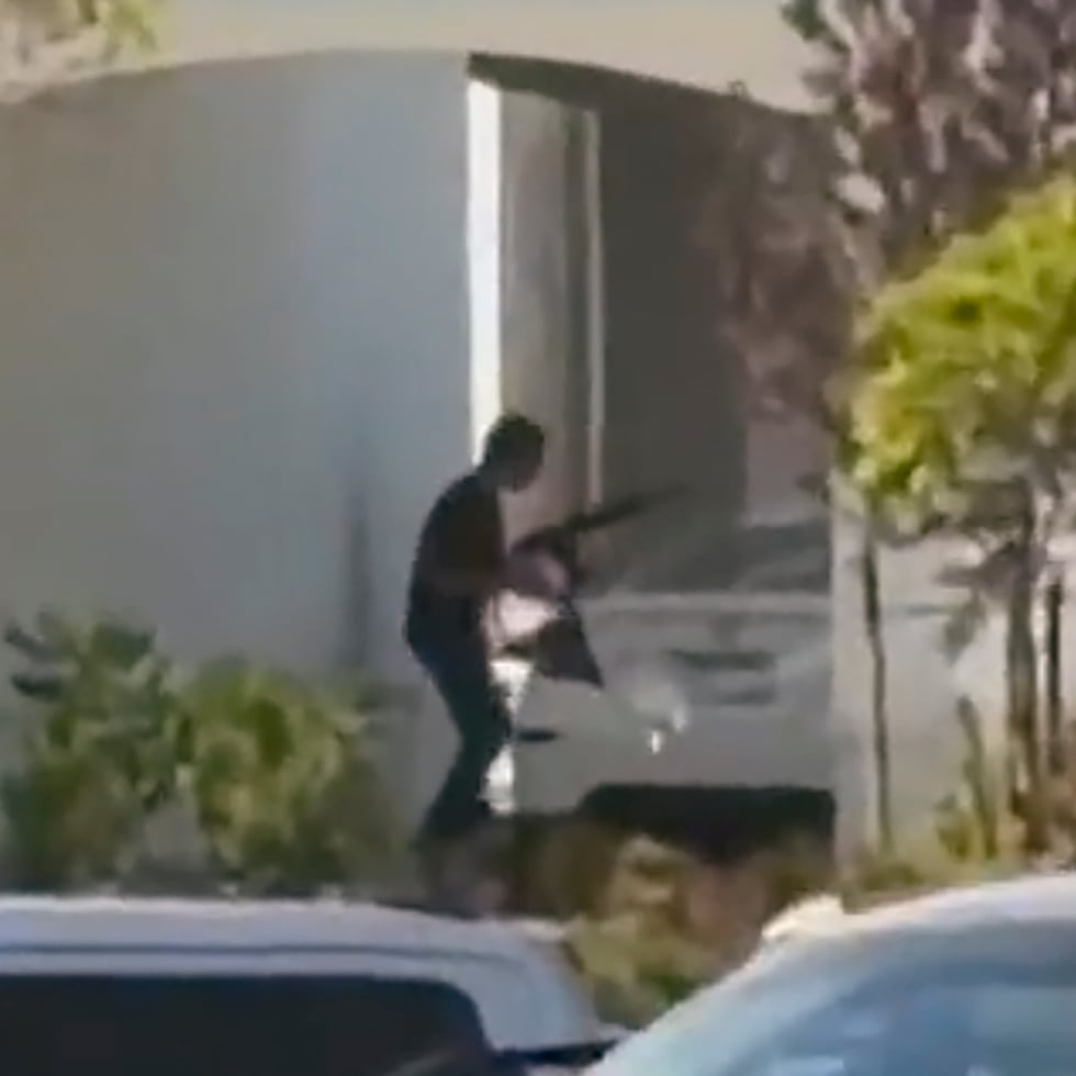 This still image captured from video by a witness shows the scene of a shooting that started at an In-N-Out Burger restaurant, Saturday, Aug. 1, 2026 in Twin Falls, Idaho. (Kevin Bell Jr. via AP)