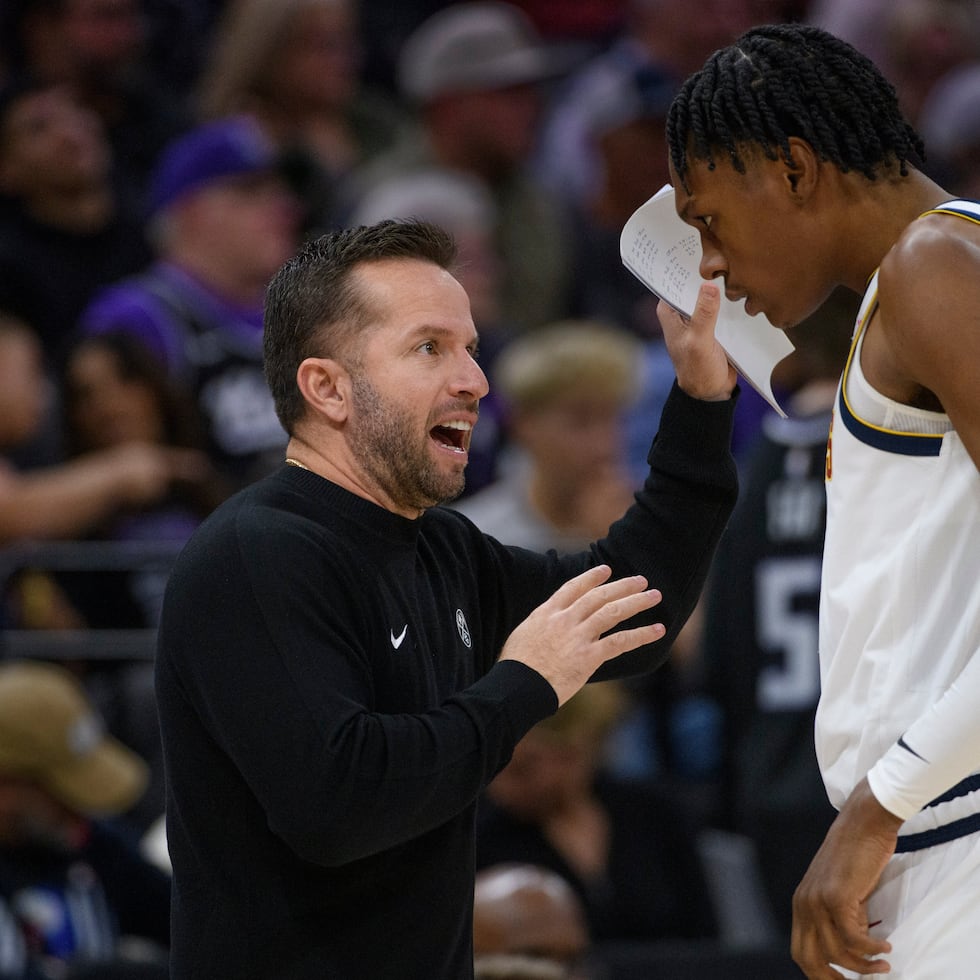 Denver Nuggets Assistant Coach José Juan Barea coaches guard Peyton Watson during a timeout in the second half of an NBA basketball game against the Sacramento Kings.