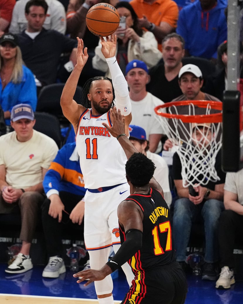 New York Knicks' Jalen Brunson (11) shoots over Atlanta Hawks' Onyeka Okongwu (17) during the first half in Game 1 of a first-round NBA playoffs basketball series, Saturday, April 18, 2026, in New York. (AP Photo/Frank Franklin II)