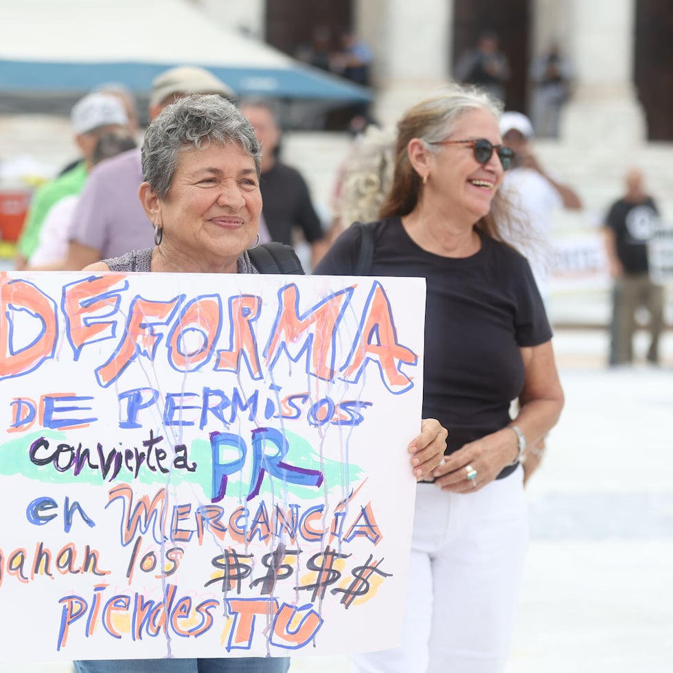 Dozens of demonstrators gathered Tuesday at Plaza de la Democracia in front of the Capitol to voice their concerns.