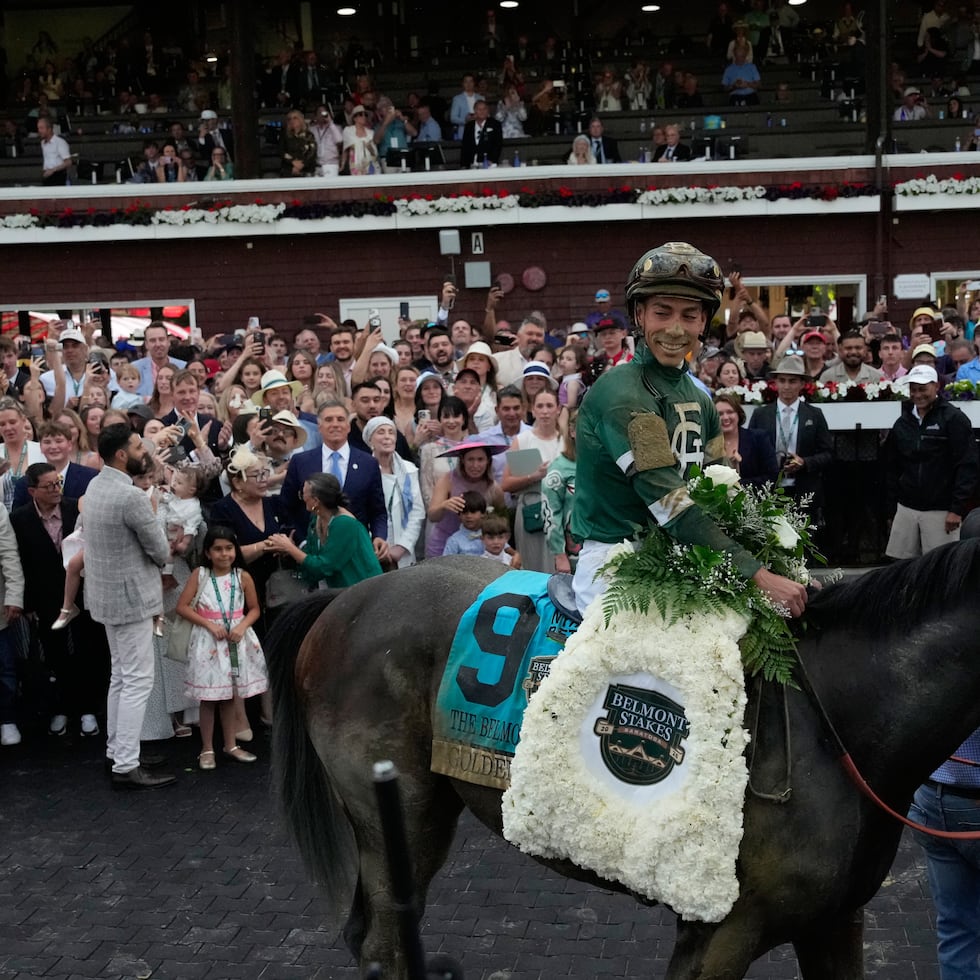 Jockey Jose Ortiz celebrates aboard Golden Tempo after winning the 158th running of the Belmont Stakes horse race, Saturday, June 6, 2026, in Saratoga Springs, N.Y. (AP Photo/Yuki Iwamura)