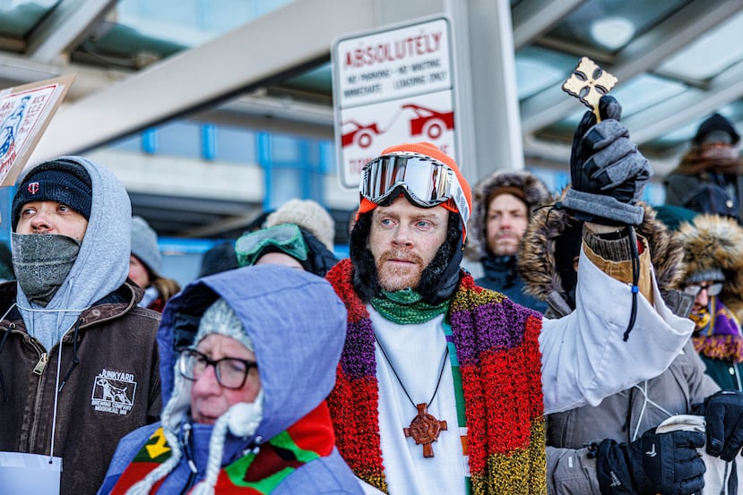 Clergy members and community activists gather at the Minneapolis-St. Paul International Airport, to protest deportation flights and urge airlines to call for an end to the Department of Homeland Security's operation, on Friday, Jan. 23, 2026, in St. Paul, Minn. (Kerem Yücel/Minnesota Public Radio via AP)