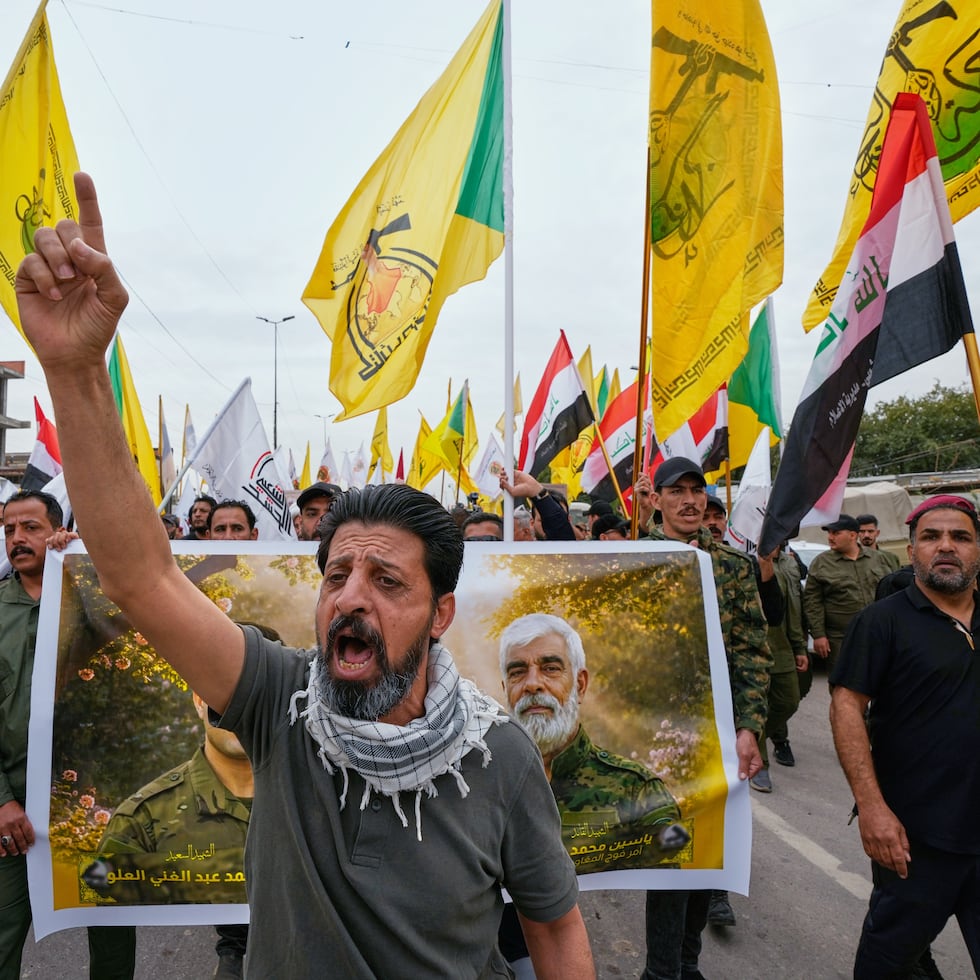 Members from the Popular Mobilization Forces attend a funeral of fighters who were killed in a U.S. airstrike, in Tal Afar, Nineveh province, north of Baghdad, Iraq, Thursday, April 2, 2026. (AP Photo/Hadi Mizban)