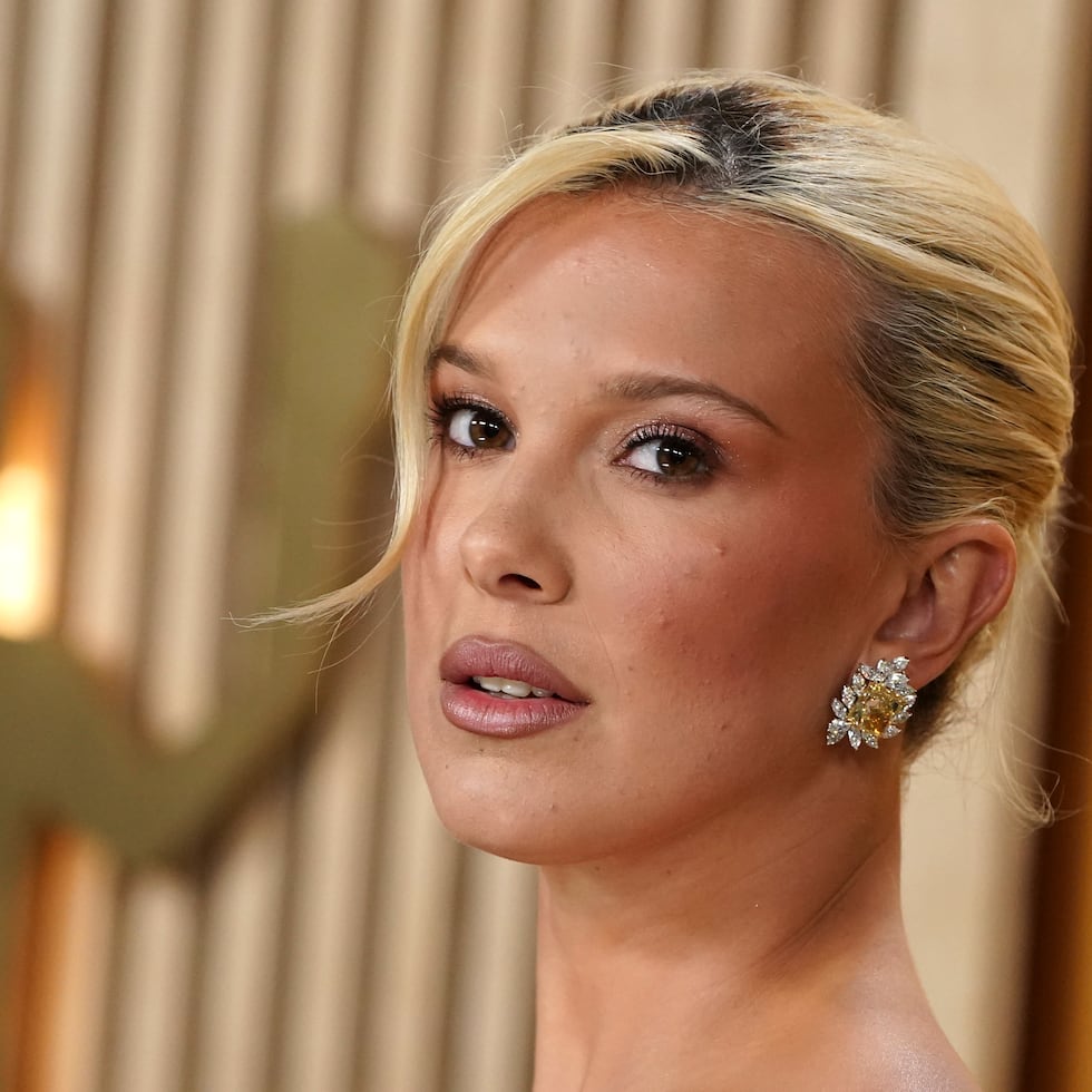 Millie Bobby Brown arrives at the 31st annual Screen Actors Guild Awards on Sunday, Feb. 23, 2025, at the Shrine Auditorium in Los Angeles. (Photo by Jordan Strauss/Invision/AP)