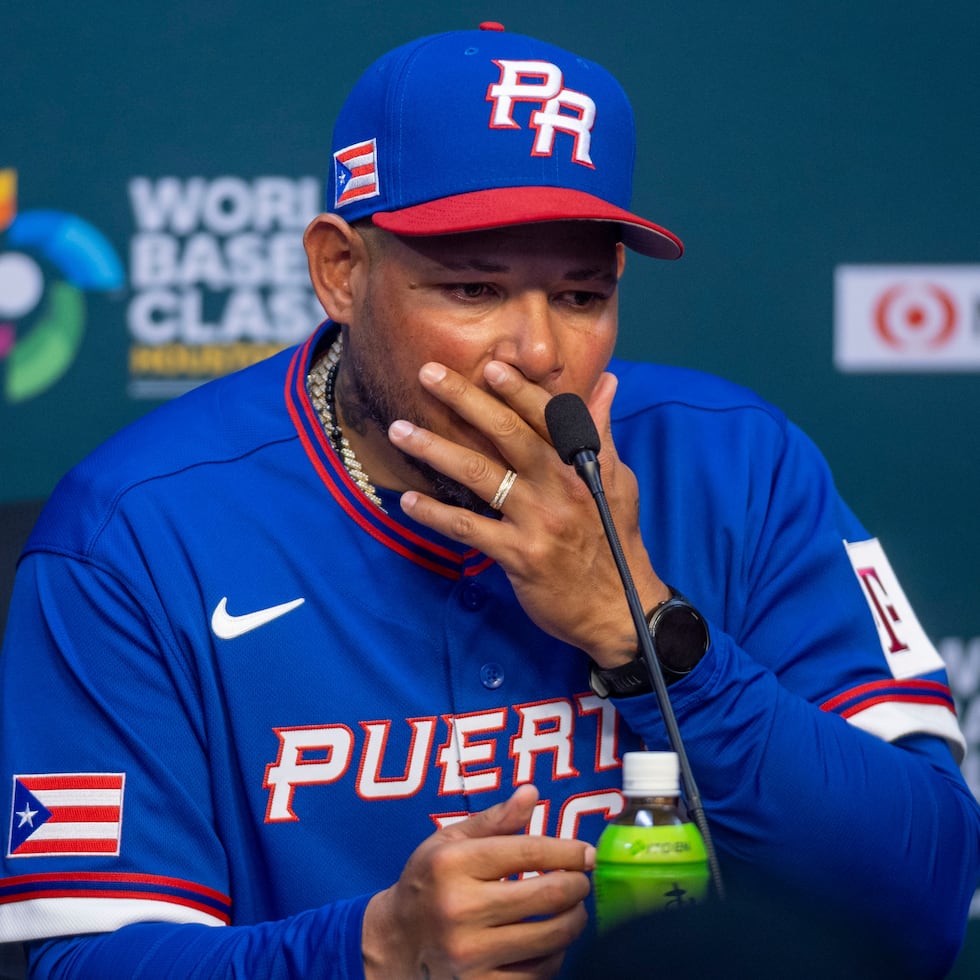 Yadier Molina reacts to Puerto Rico's setback at the post-game press conference.