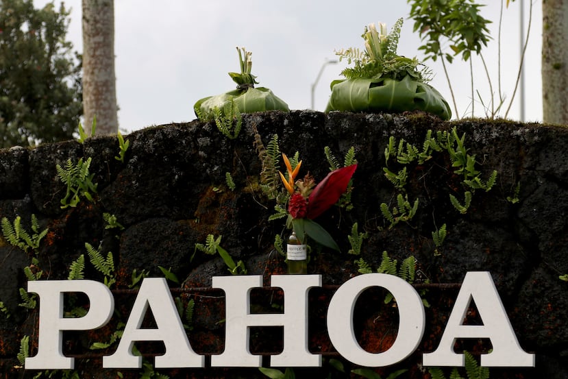 FILE - A sign welcomes people to Pahoa, Hawaii, on May 15, 2018. (AP Photo/Caleb Jones, File)