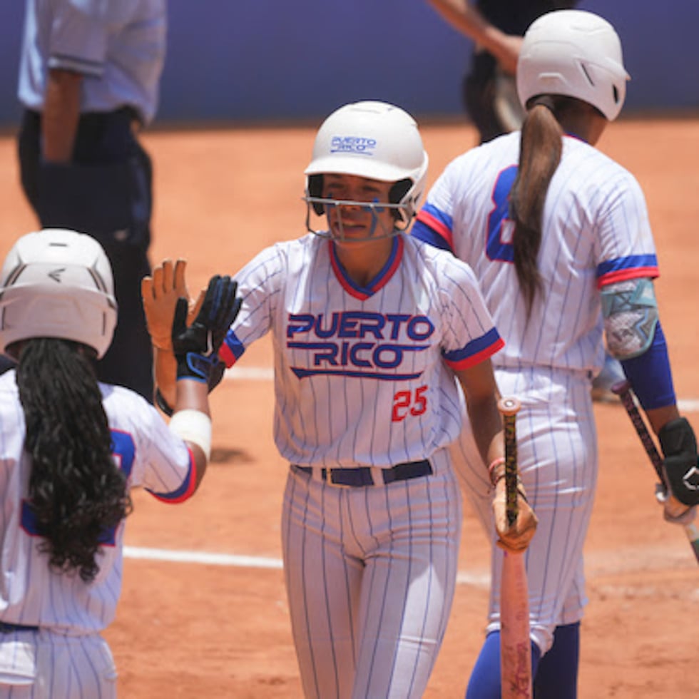 Puerto Rico's women's national softball team celebrates one of its victories at the Santo Domingo 2026 Central American and Caribbean Games.