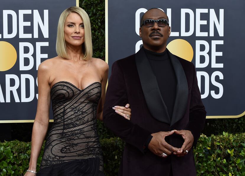 Paige Butcher y Eddie Murphy. (AP)