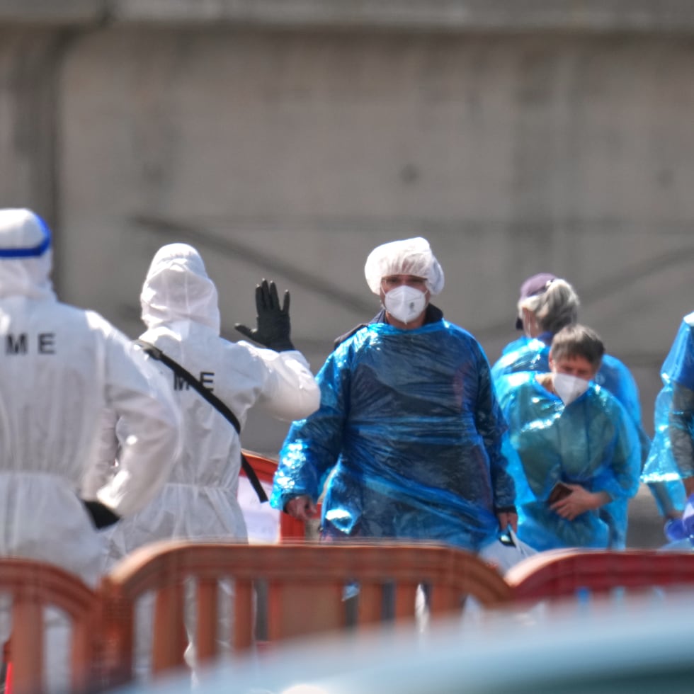 Passengers are disembarked from the hantavirus-stricken cruise ship MV Hondius at the port of Granadilla in Tenerife, Canary Islands, Spain, Sunday, May 10, 2026. (AP Photo/Manu Fernandez)