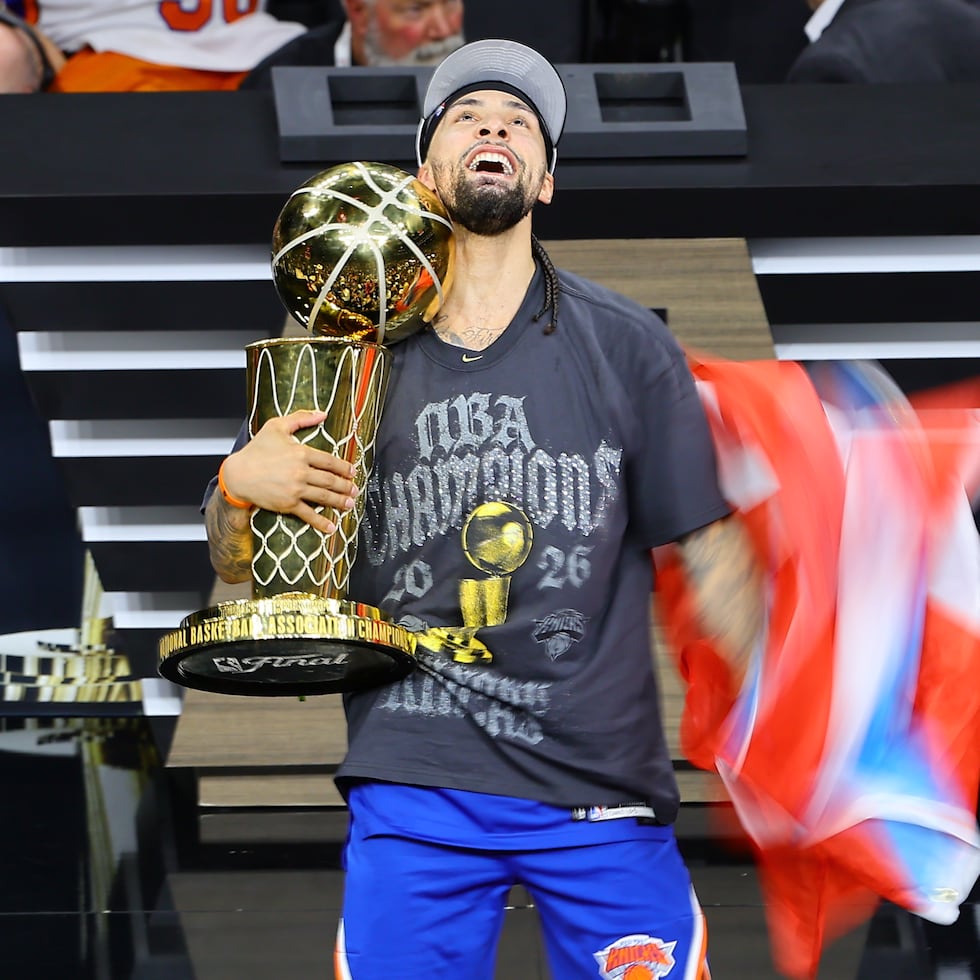 Puerto Rican José Alvarado celebrates after winning the NBA championship with the New York Knicks.