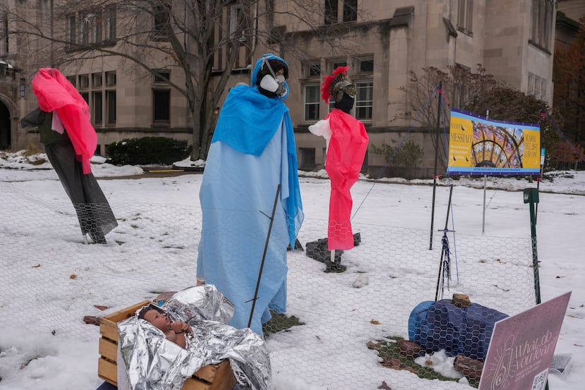 A mannequin representing the Mother Mary wears a mask in the Nativity scene outside of Lake Street Church of Evanston, Wednesday, Dec. 10, 2025, in Evanston, Ill. (AP Photo/Erin Hooley)