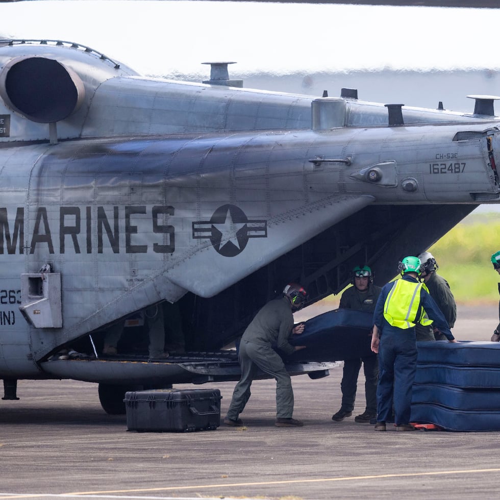 In a photo taken on September 2, 2025, U.S. Navy personnel move equipment on the runway at the former Roosevelt Roads military base in Ceiba, where the Corps has resumed training.