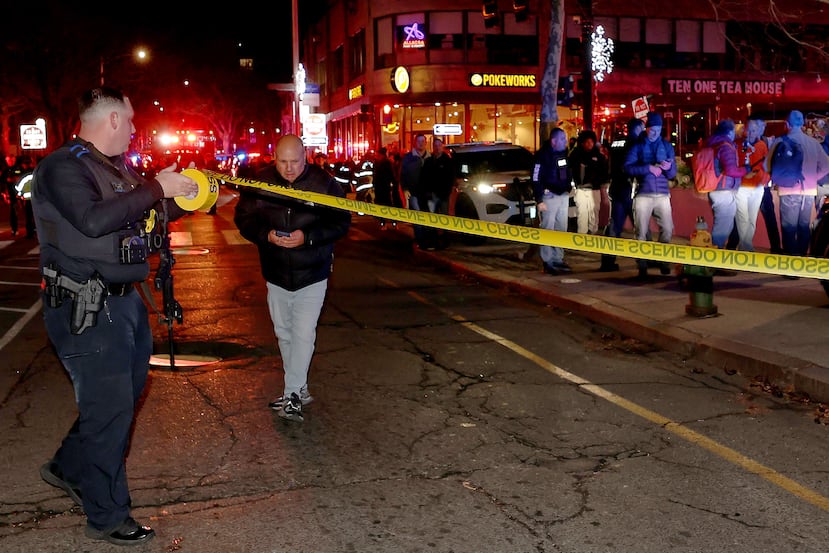 Emergency personnel gather on Waterman Street at Brown University in Providence, R.I., on Saturday, Dec. 13, 2025, during the investigation of a shooting. (AP Photo/Mark Stockwell)