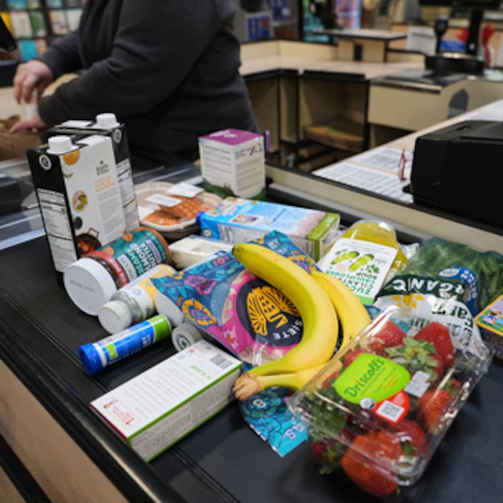 A cashier scans groceries, including produce, which is covered by the USDA Supplemental Nutrition Assistance Program (SNAP), at a grocery store in Baltimore, Monday, Nov. 10, 2025. (AP Photo/Stephanie Scarbrough)