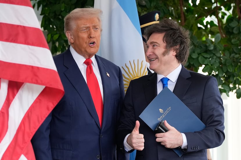 President Donald Trump greets Argentina's President Javier Milei at the White House, Tuesday, Oct. 14, 2025, in Washington. (AP Photo/Alex Brandon)