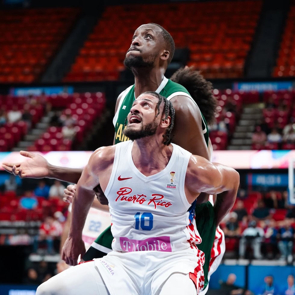 Christian Negrón of Puerto Rico battles for a rebound against Romaro Gill of Jamaica.