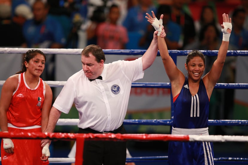 Kiria Tapia (derecha) celebra su victoria ante la mexicana Erika Cruz (izquierda) en la final de los 60 kilogramos de los Juegos Panamericanos de Guadalajara 2011.