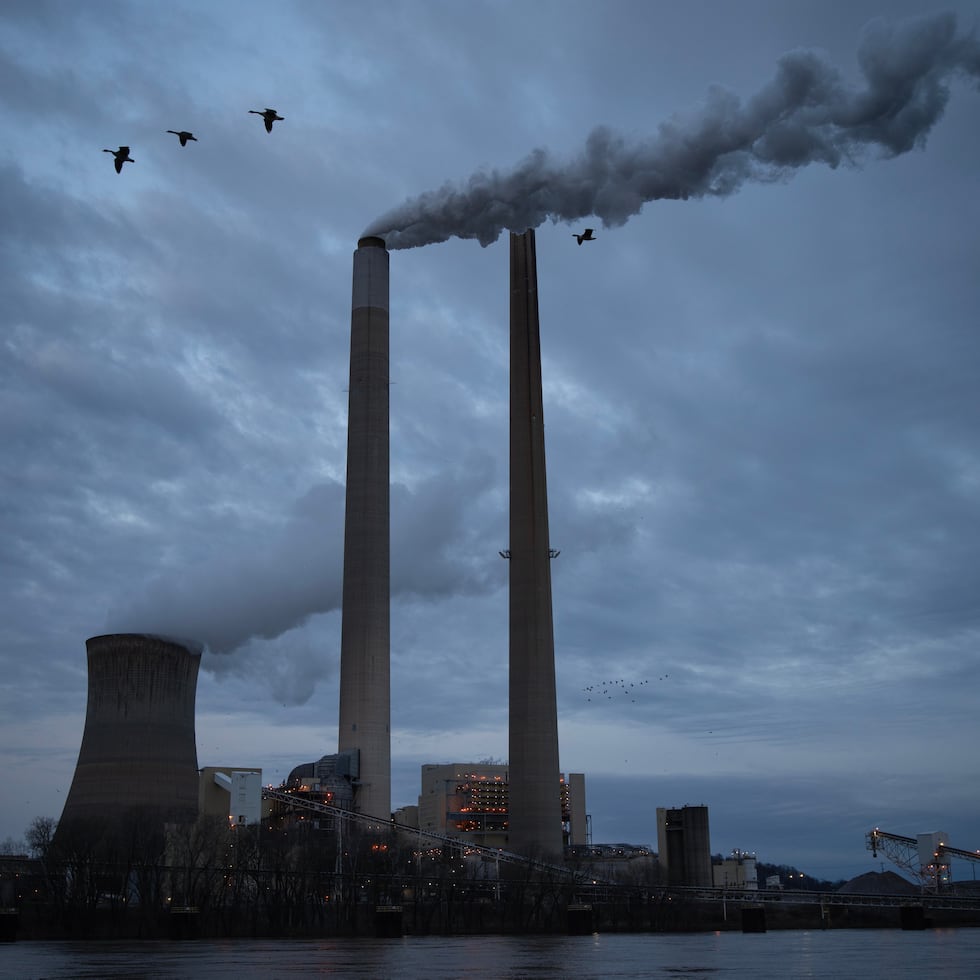 FILE - The coal-fired Mountaineer Power Plant, near New Haven, W.Va., operates across the Ohio River from the Lock 24 RV Park and Campground in Racine, Ohio, March 13, 2026. (AP Photo/Carolyn Kaster, File)