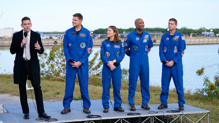FILE - NASA administrator Jared Isaacman, left, answers questions during a news conference, next to the crew of the new moon rocket, Artemis II, from left, Canadian Space Agency astronaut Jeremy Hansen, mission specialist Christina Koch, pilot Victor Glover and commander Reid Wiseman at the Kennedy Space Center, Jan. 17, 2026, in Cape Canaveral, Fla. (AP Photo/John Raoux, FIle)