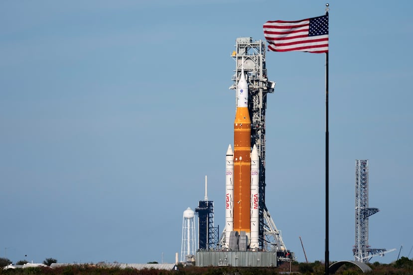 FILE - NASA's Artemis II SLS (Space Launch System) moon rocket with the Orion spacecraft slowly rolls back towards the Vehicle Assembly Building at the Kennedy Space Center, Feb. 25, 2026, in Cape Canaveral, Fla. (AP Photo/John Raoux, File