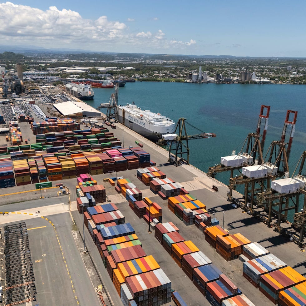 The sun shines down on cargo cranes and loading bays at the edge of San Juan port, Puerto Rico, Thursday, May 8, 2025.