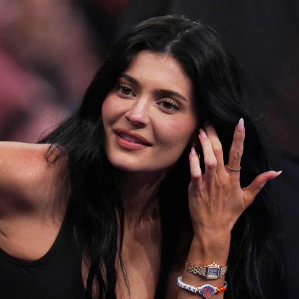 Kylie Jenner talks to colleagues during the second half of Game 4 in the Eastern Conference semifinals of the NBA basketball playoffs between the New York Knicks and the Boston Celtics Monday, May 12, 2025, in New York. (AP Photo/Frank Franklin II)