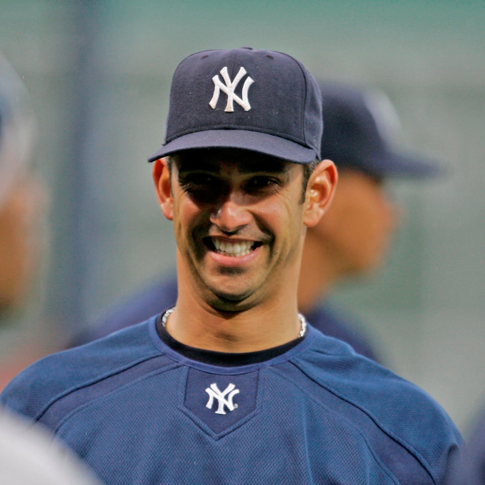 New York Yankees catcher Jorge Posada jokes with teammates prior to their baseball game against the Boston Red Sox at Fenway Park in Boston, Friday April 11, 2008.