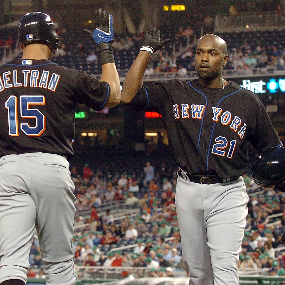 Así como compartieron el terreno de juego y el mismo dugout como compañeros de los Mets, Carlos Delgado (derecha) estará junto a Carlos Beltrán el domingo durante su exaltación al Salón de la Fama.