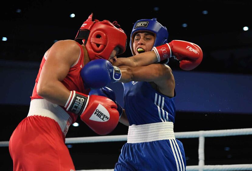 Ashleyann Lozada (en uniforme azul) venció a la colombiana Yeni Castañeda con puntuación de 4-1.